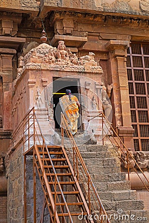 Devotee entering a Hindu shrine in tamil Nadu Editorial Stock Photo